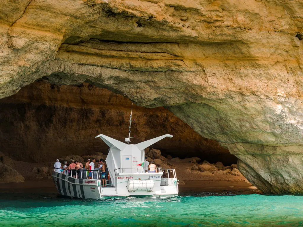 boat catamaran in the benagil cave by algarexperience
