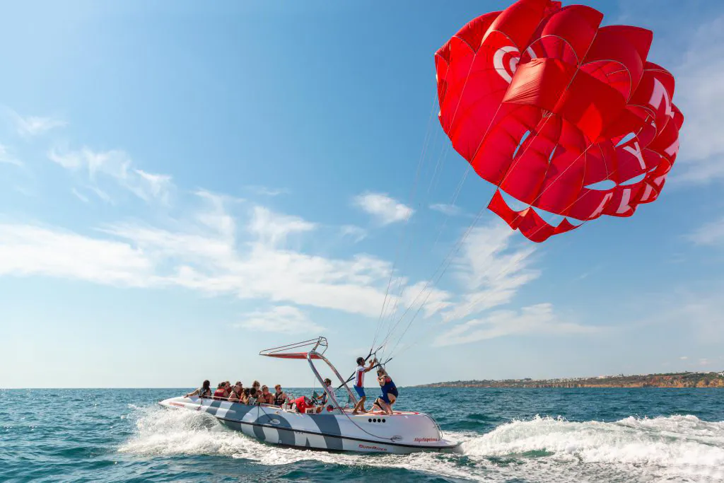 speed boat making parasailing experience by algarexperience