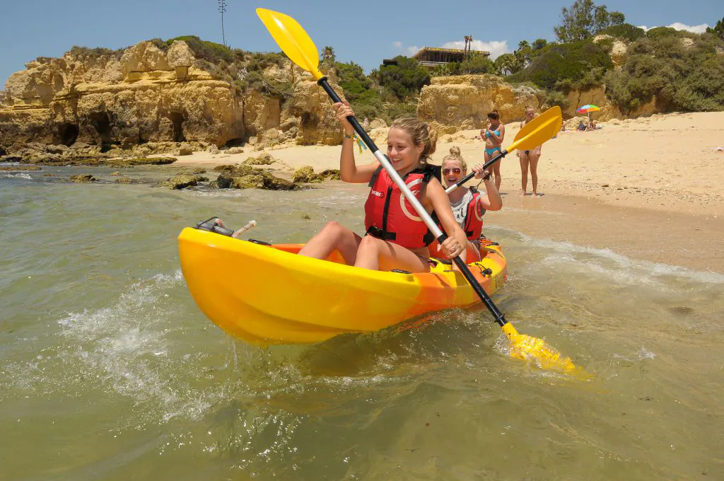 girls start with kayaks at beach albufeira algarexperience