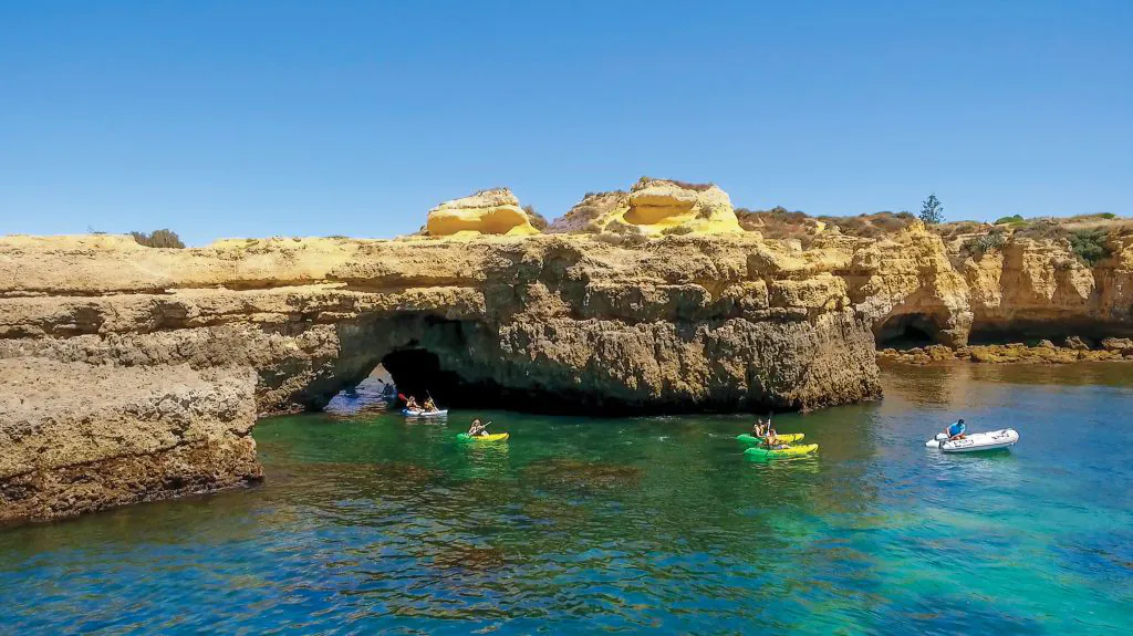 kayaks exploring caves with algarexperience